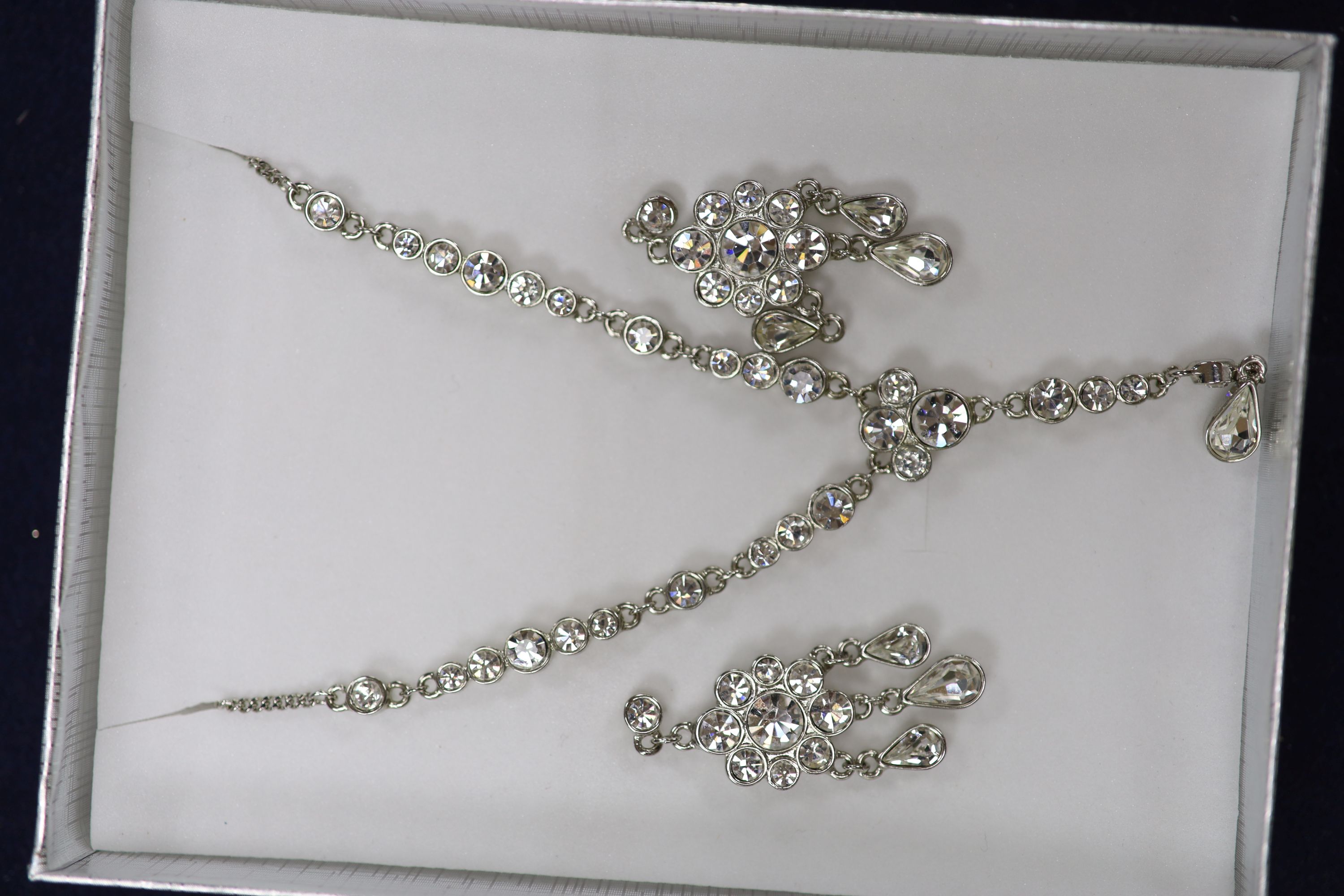 A large quantity of Swarovski costume jewellery and one hundred and thirty mainly 925 rings.